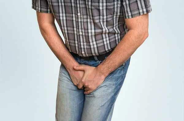 What causes hot feet and damp scrotum?