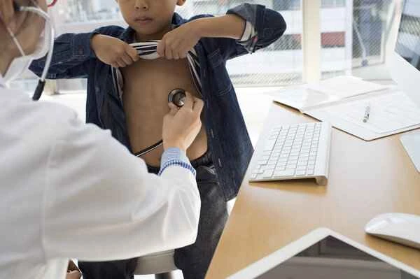 What causes a boy's scrotum to be loose?